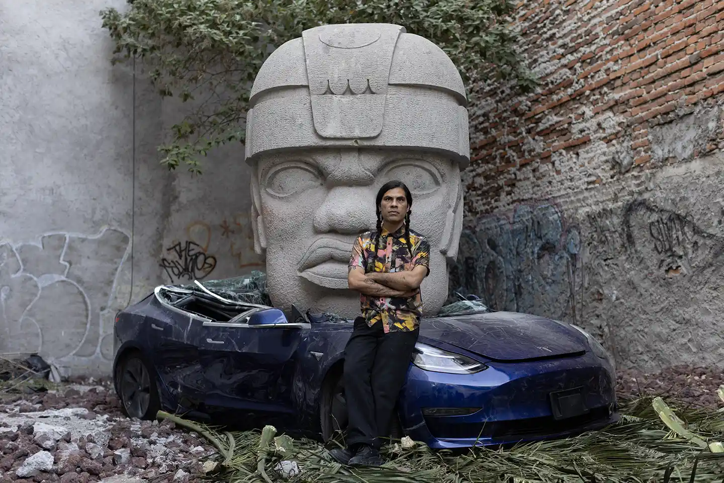 Chavis Mármol beside Tesla Crushed by an Olmec Head